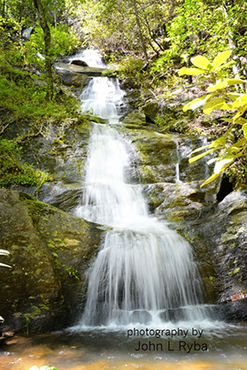 The waterfall cascades 100-feet down the mountain side, with a wading pond at the bottom. 